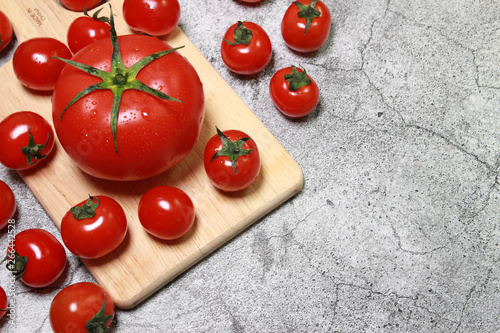 fresh tomatoes on a wooden board