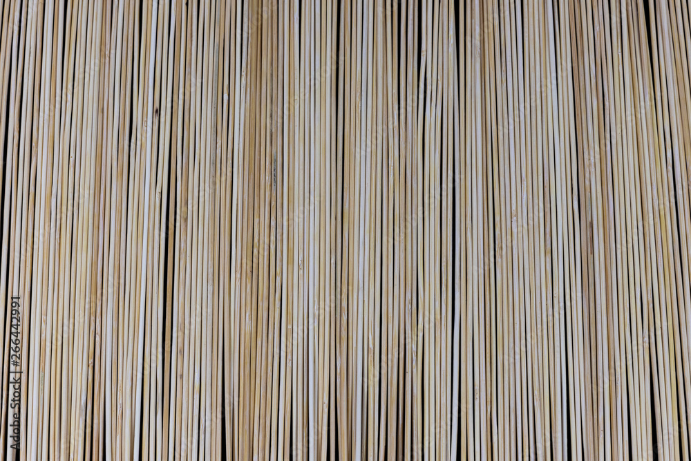 Wooden bamboo skewers set on a black backdrop for background purposes. Texture, natural Wooden bamboo skewers set on a black backdrop for background purposes. Texture, natural