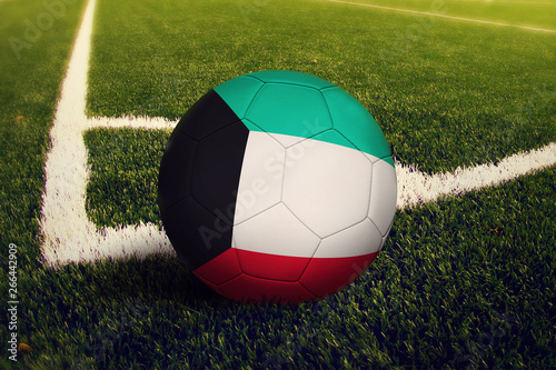 Kuwait ball on corner kick position  soccer field background. National football theme on green grass.
