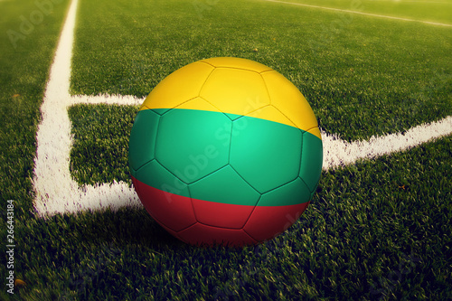 Lithuania ball on corner kick position  soccer field background. National football theme on green grass.