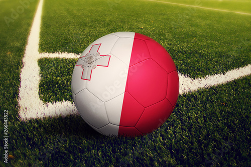 Malta ball on corner kick position  soccer field background. National football theme on green grass.