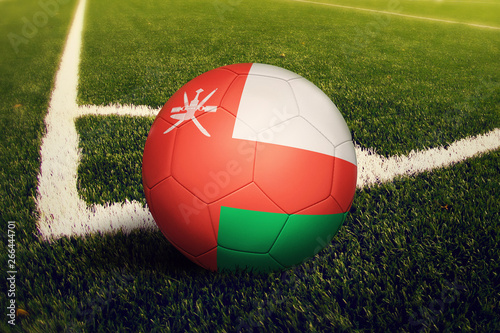 Oman ball on corner kick position  soccer field background. National football theme on green grass.