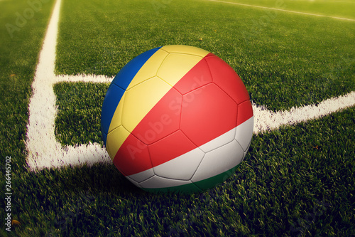 Seychelles ball on corner kick position  soccer field background. National football theme on green grass.