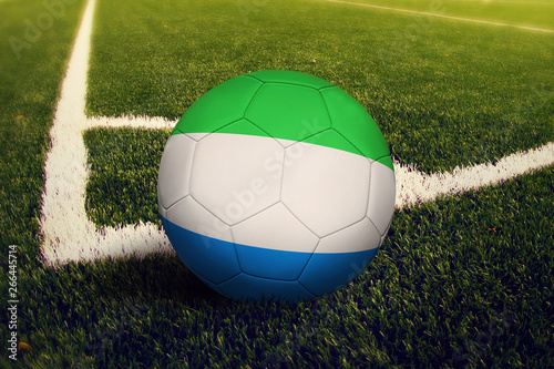 Sierra Leone ball on corner kick position  soccer field background. National football theme on green grass.