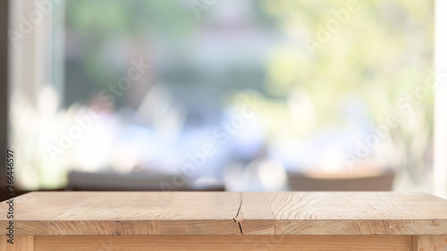 Top wood table in living room window background