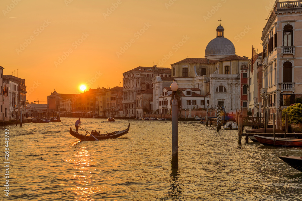 Sunset Grand Canal - A colorful sunset view of the Grand Canal, Venice, Veneto, Italy. No recognizable trademark, logo or person in the image.