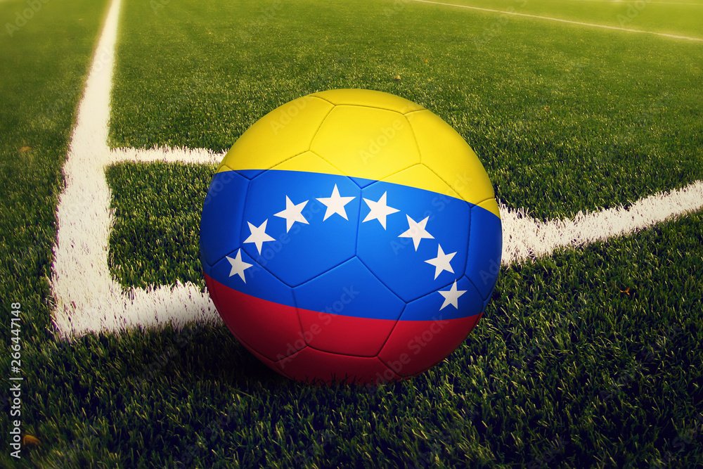 Venezuela ball on corner kick position, soccer field background. National football theme on green grass. Venezuela ball on corner kick position, soccer field background. National football theme on green grass.