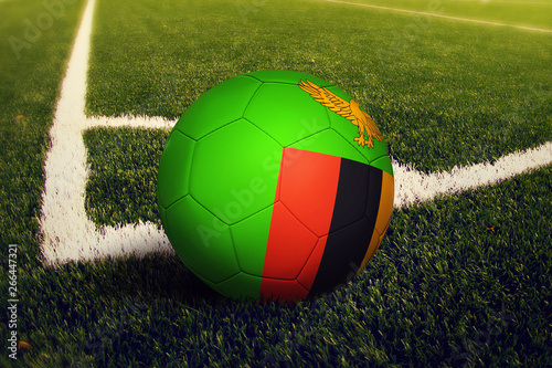 Zambia ball on corner kick position  soccer field background. National football theme on green grass.