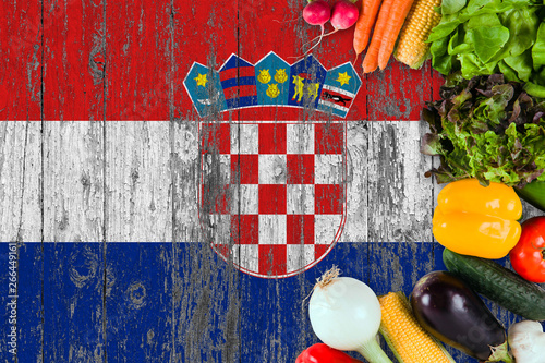 Fototapeta Naklejka Na Ścianę i Meble -  Fresh vegetables from Croatia on table. Cooking concept on wooden flag background.