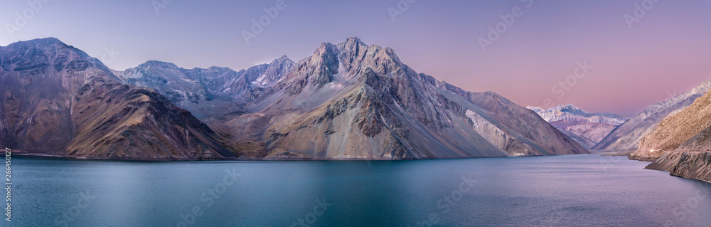 Embalse del Yeso (Yeso Dam) awe high altitude turquoise waters lake inside an amazing rugged landscape. Steep mountains on an awe scenery with the river stopped by the dam inside Andes mountains