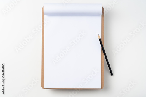 white flipped paper on clipboard isolated on white