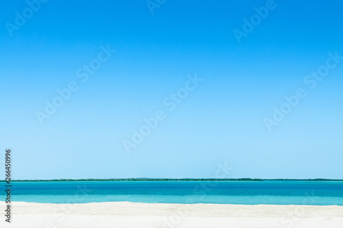 Blue sea white beach under bright sky at Yas Island. Abu Dhabi. UAE