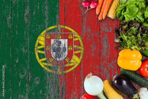 Fresh vegetables from Portugal on table. Cooking concept on wooden flag background.