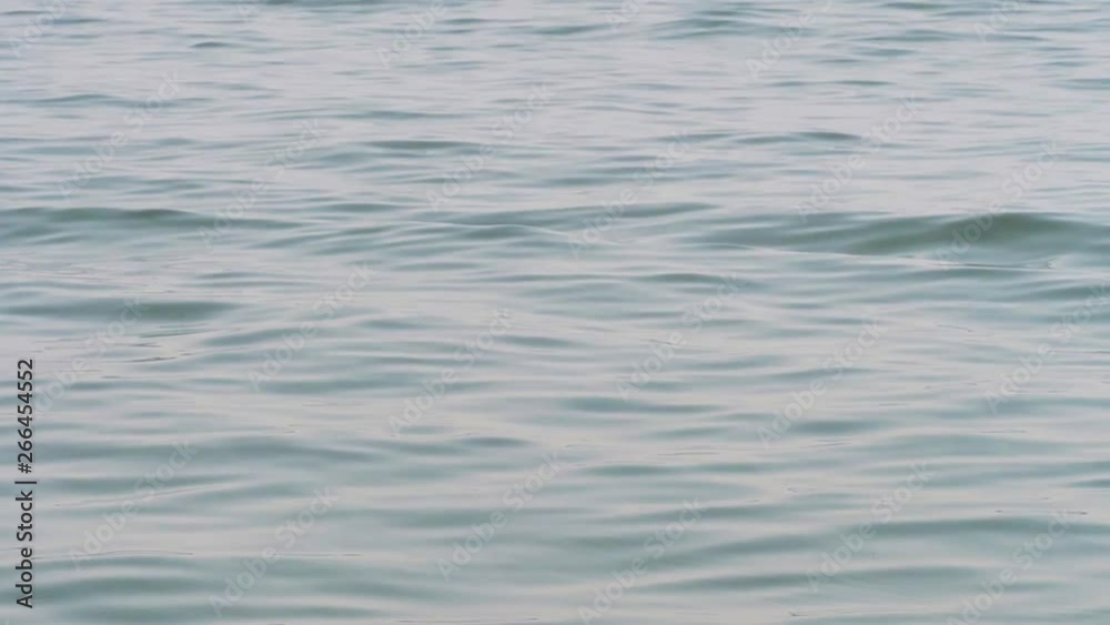 Close up of the calm blue water of west lake. Slow motion Close up of the calm blue water of west lake. Slow motion