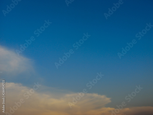 Deep blue sky and white cloud background.