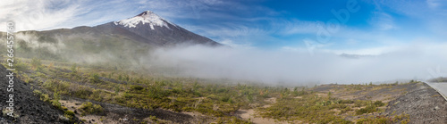 Amazing panoramic view of Osorno Volcano volcanic cone summit. Awe volcanic scenery on a remote location on a misty day with a moody atmosphere just an amazing Patagonia scenic landscape