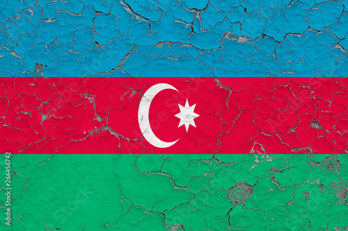 Flag of Azerbaijan painted on cracked dirty wall. National pattern on vintage style surface.