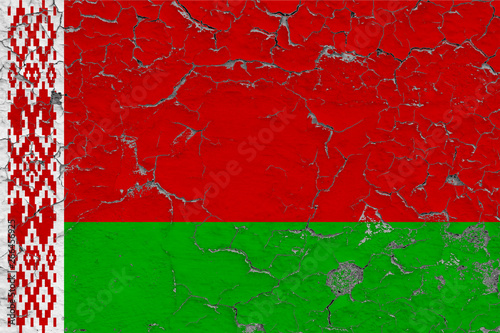 Flag of Belarus painted on cracked dirty wall. National pattern on vintage style surface. © sezerozger