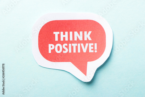 Think Positive Speech Bubble Isolated On Blue Background