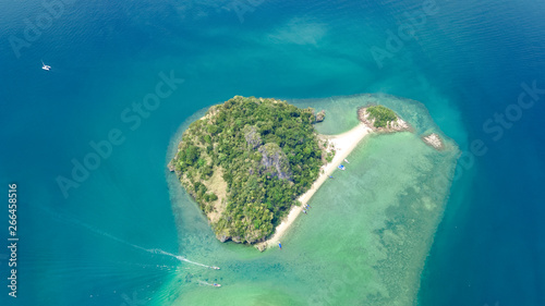 Aerial drone view of tropical islands, beaches and boats in blue clear Andaman sea water from above, beautiful archipelago islands of Krabi, Thailand
