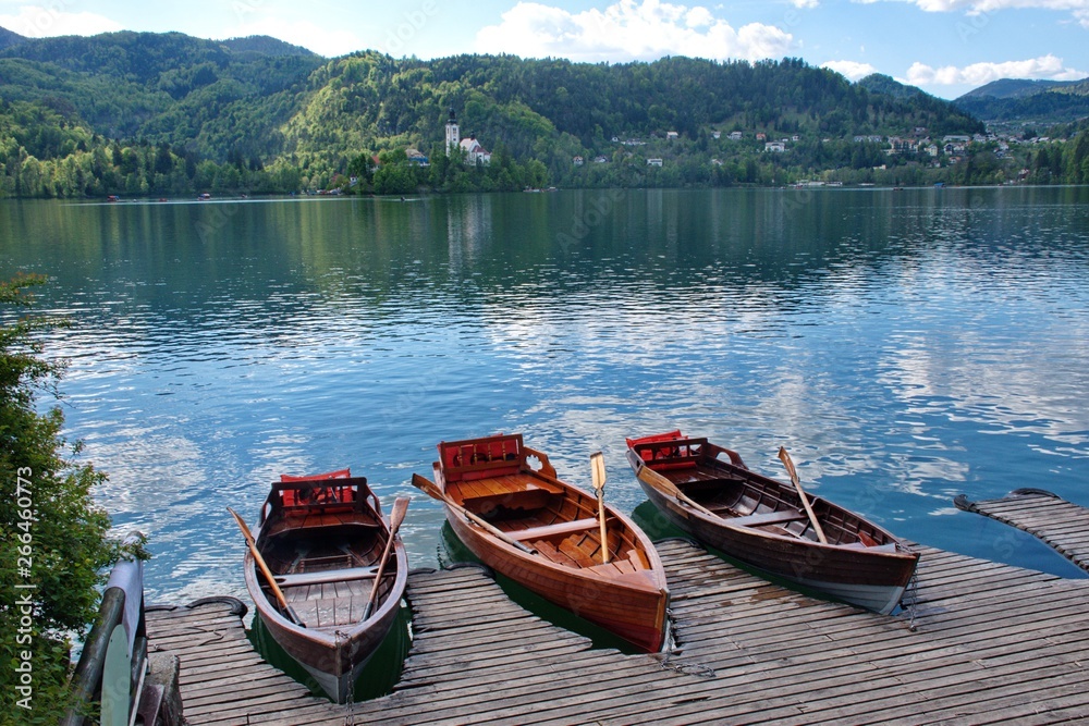 Boats on the wooden board on the lake in Slovenia