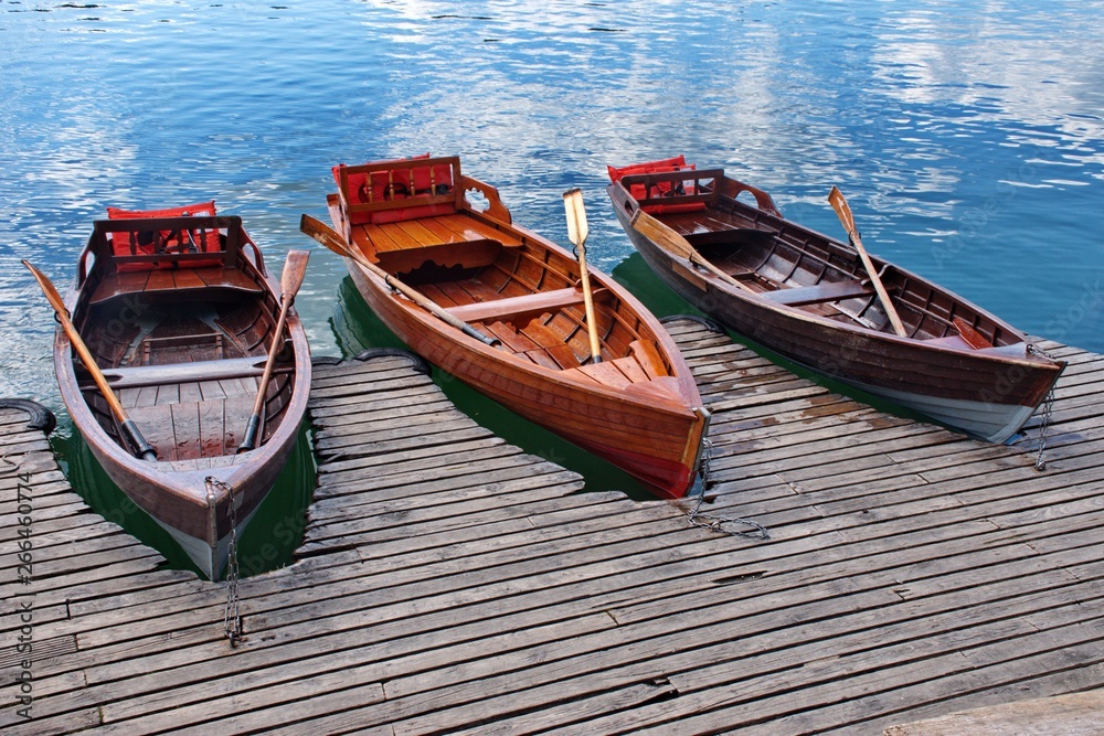 Boats on the wooden board on the lake in Slovenia