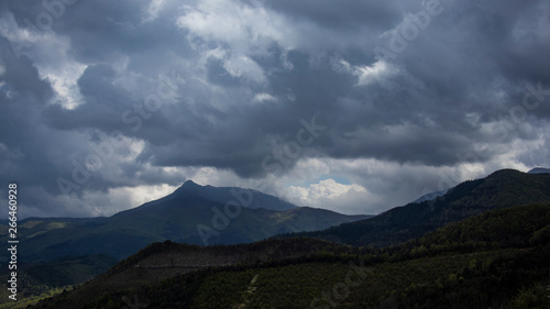 Dark cloudscape on a mountain landscape silhouette