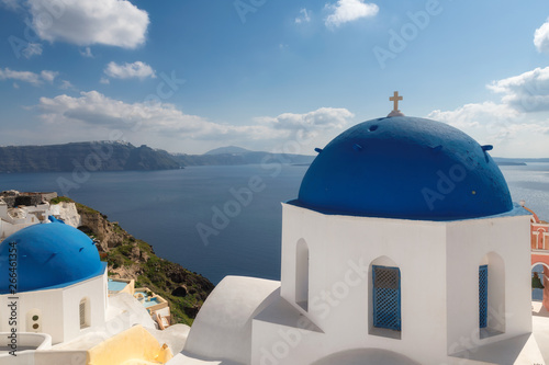 Santorini, Greece. Spectacular view of Greek orthodox church with blue domes and sea in Oia town, Santorini island, Greece.