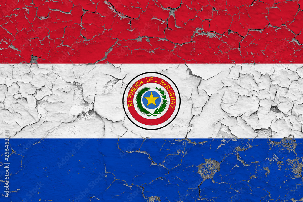Flag of Paraguay painted on cracked dirty wall. National pattern on vintage style surface.