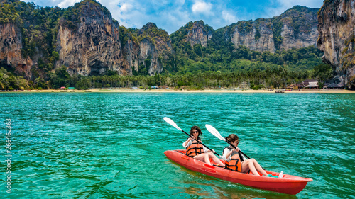 Family kayaking, mother and daughter paddling in kayak on tropical sea canoe tour near islands, having fun, active vacation with children in Thailand, Krabi