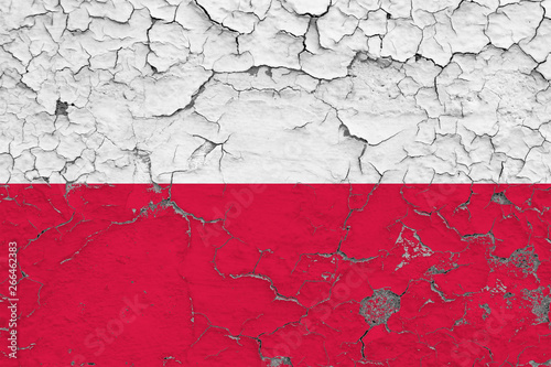 Flag of Poland painted on cracked dirty wall. National pattern on vintage style surface.