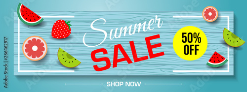 Vector summer sale banner with pieces of ripe fruit on blue wood desk