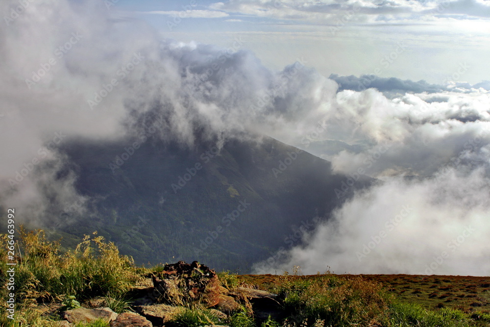 Fototapeta premium Clouds and fog over Carpathian mountains