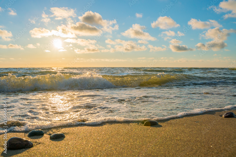 Very beautiful view of the sea coast at sunset. The Baltic Sea is washed by a sea wave. Very beautiful view of the sea coast at sunset. The Baltic Sea is washed by a sea wave.