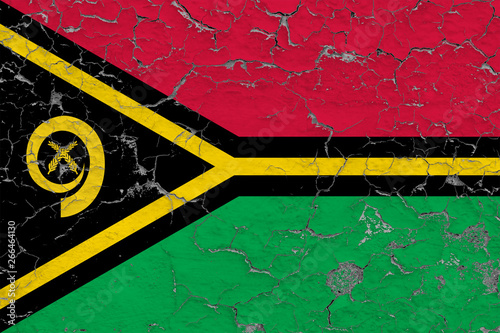 Flag of Vanuatu painted on cracked dirty wall. National pattern on vintage style surface. © sezerozger