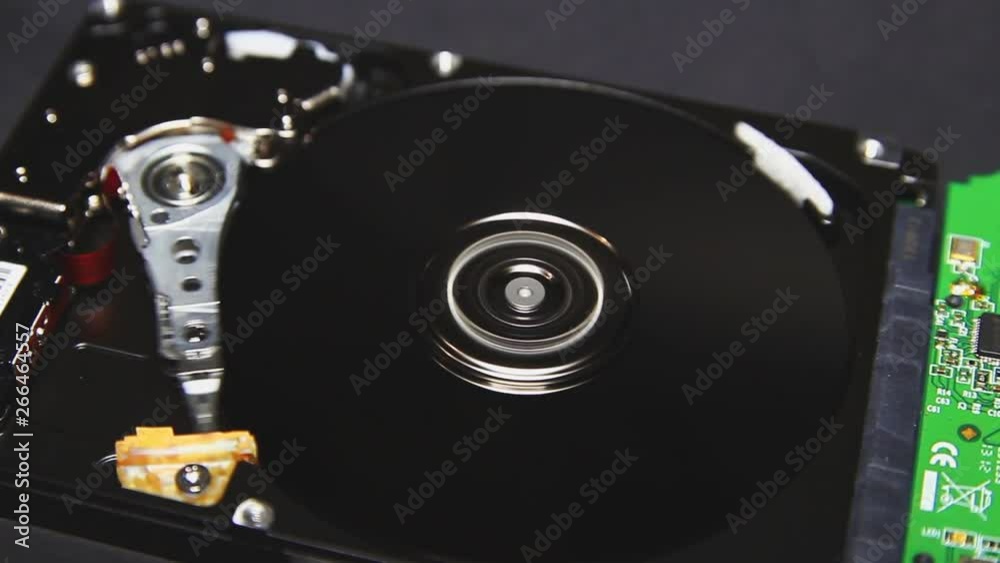 Computer hard disk, hdd. Head and hard drive spindle close-up. Technology of information storage. Arrays of data, servers. innovative technologies. Storage and transmission of information Computer hard disk, hdd. Head and hard drive spindle close-up. Technology of information storage. Arrays of data, servers. innovative technologies. Storage and transmission of information