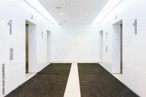 Hall with elevators in a modern office and residential building. Comfort and convenience technology.  © Evgenii Starkov