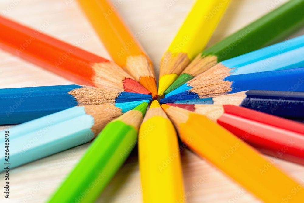 Color pencils in a circle on a white background. Drawing with colored pencils. Color pencils in a circle on a white background. Drawing with colored pencils.