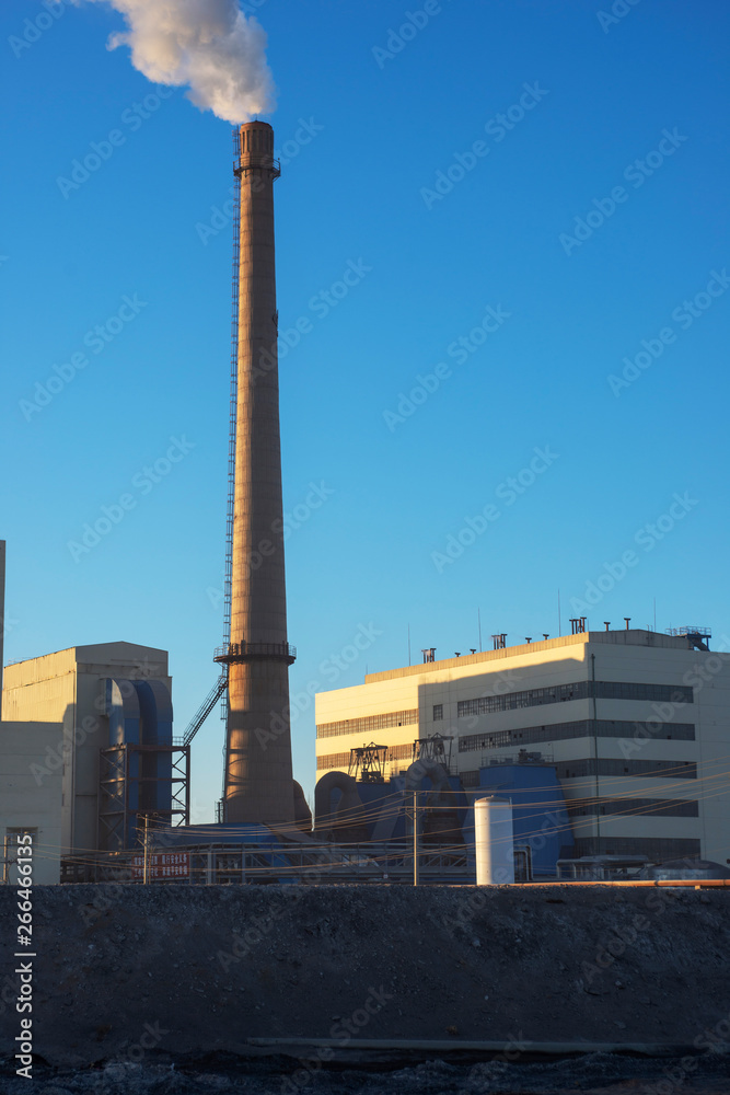 Factory cooling tower steam at sunset Factory cooling tower steam at sunset