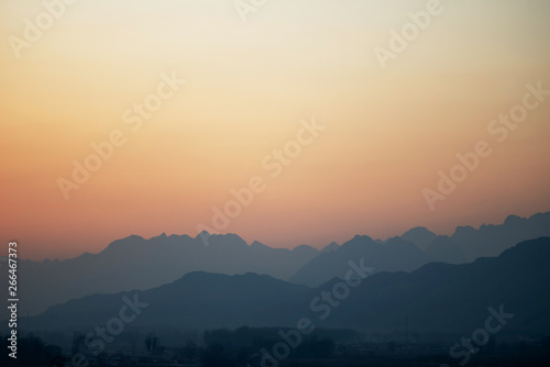 The misty peaks were at sunset © photobee