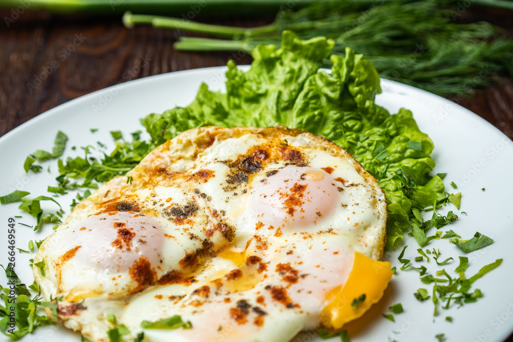 Flat lay of tasty breakfast over grey concrete table background. Fried eggs, micro greens, fresh tomatoes in plate, top view. Clean eating, dieting, vegetarian food - Image Flat lay of tasty breakfast over grey concrete table background. Fried eggs, micro greens, fresh tomatoes in plate, top view. Clean eating, dieting, vegetarian food - Image