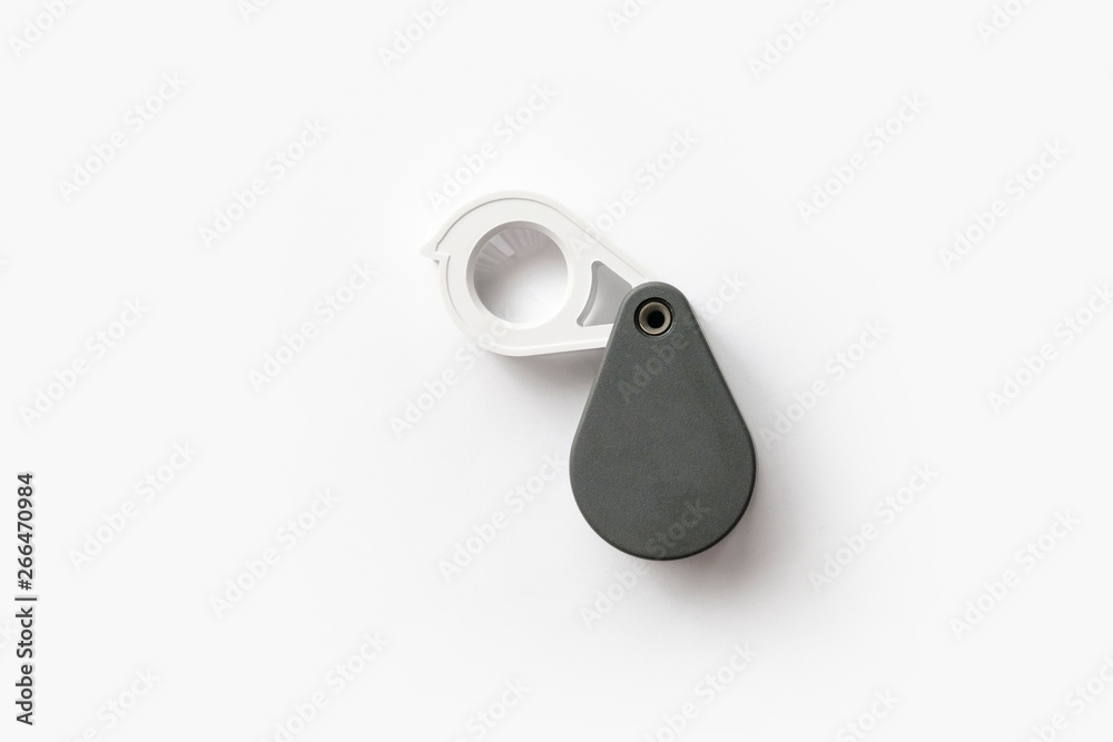 Magnifying glass for diamonds or see the amulet Isolated on a White Background. Magnifying glass for diamonds or see the amulet Isolated on a White Background.