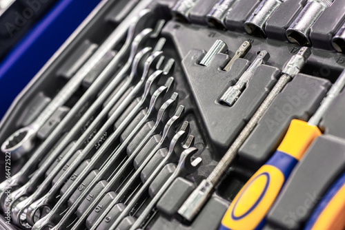 A set of wrenches in a plastic box. A set for car repair. Close-up photo.