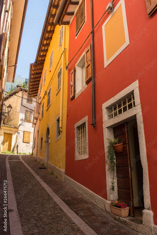 Fototapeta premium An historic street in the north eastern Italian city of Gorizia in the Friuli Venezia Giulia region. The street leads to the historic Cocevia part of the city