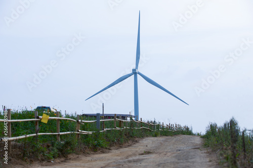 wind turbines on the mountain,Wind turbines produce electricity with a view of the countryside.