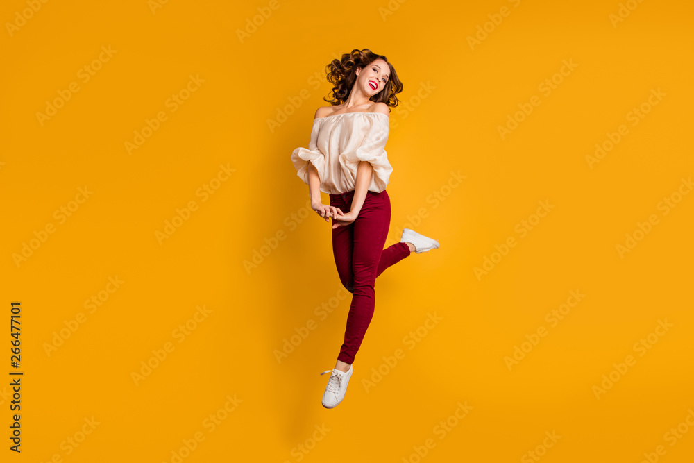 Full length body size view portrait of her she nice-looking attractive aforable pretty winsome cheerful cheery wavy-haired lady having fun isolated over bright vivid shine yellow background