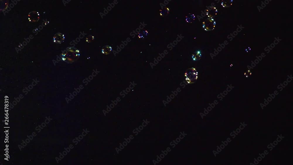 Soap bubbles on black background 4K
