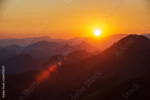 sunset in mountains and flair in laos