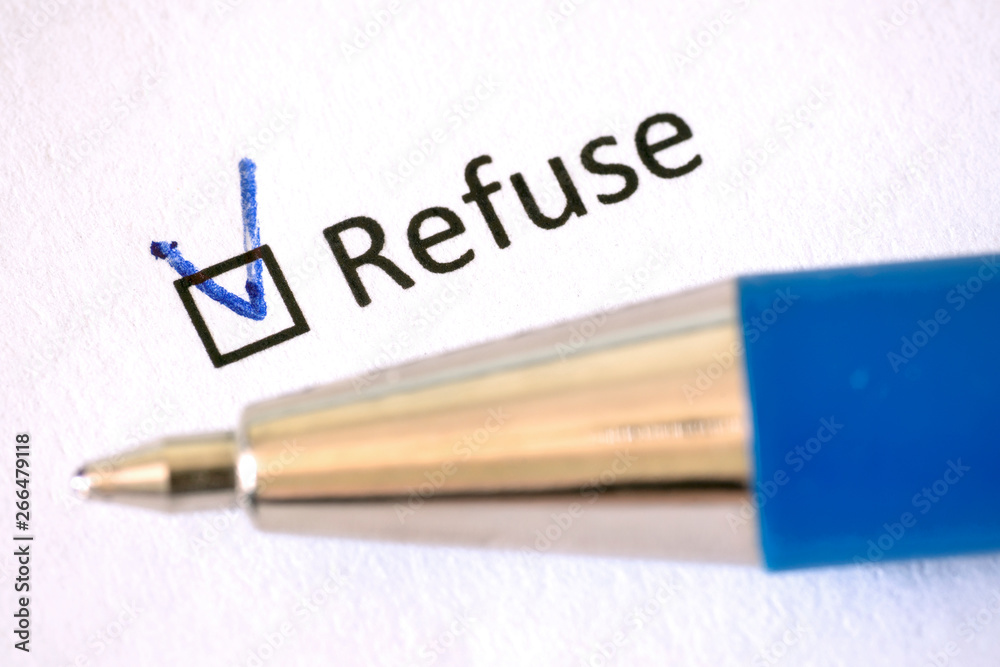 Questionnaire - blue pen and the inscription REFUSE with check mark on the white paper Questionnaire - blue pen and the inscription REFUSE with check mark on the white paper