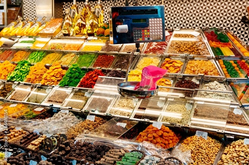 Dried fruits and sweets on market stall photo